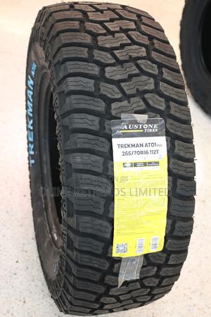 LLANTA AUSTONE "TREKMAN AT01" A/T LT 235/70 R16 106T TL (COCADA HUESITO & LETRA BLANCA)